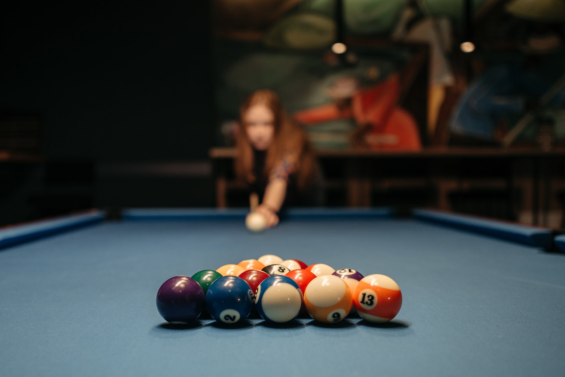 A Woman Playing Billiards